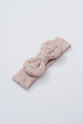 Avauma Lovely Bloom Headband in Rose Cocoa, made of dusty pink ribbed fabric adorned with tiny rosebud floral print